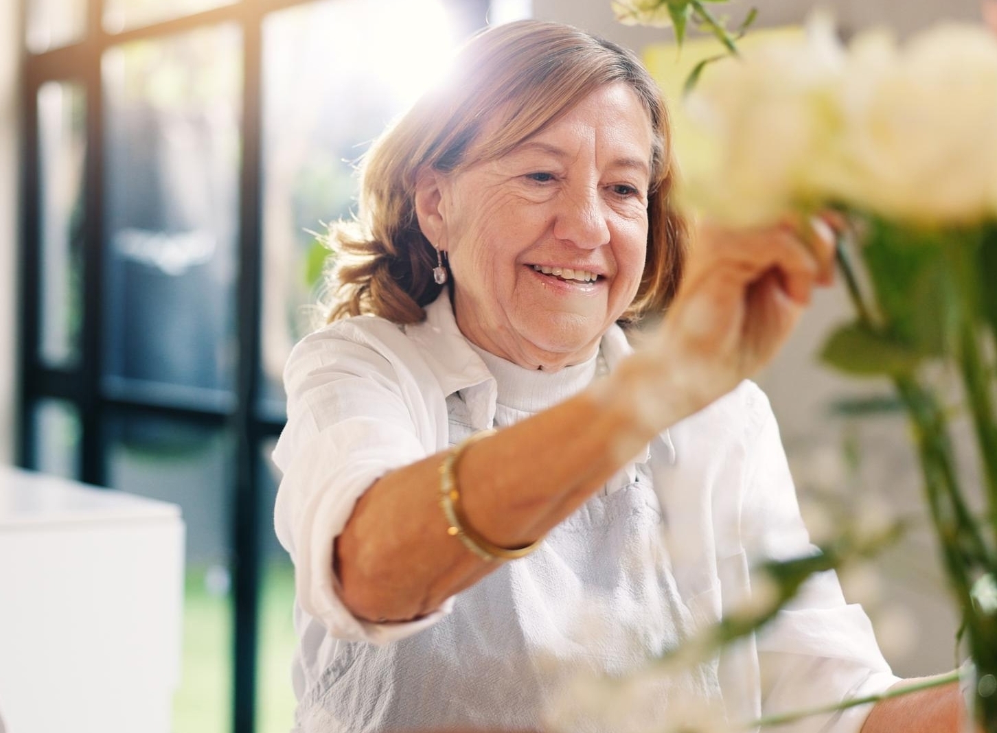 Philanthropist working on flower arrangement